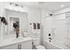 Well-lit bathroom with a combination tub and shower, modern fixtures, and a single sink vanity at 917 Montague Ave, Durham, NC 27703
