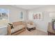 Bedroom featuring a crib, comfortable rocking chair, and soft natural light at 917 Montague Ave, Durham, NC 27703