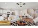 Open-concept living space featuring hardwood floors, stylish furniture, and a modern staircase at 917 Montague Ave, Durham, NC 27703