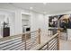 Upstairs loft area with a laundry closet, a small desk, and decorative artwork at 917 Montague Ave, Durham, NC 27703