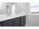 Bathroom vanity with double sinks, modern cabinets, and a quartz countertop at 928 Allen Park Dr, Knightdale, NC 27604