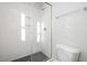 Bathroom features a glass-enclosed shower with black and white tile at 928 Allen Park Dr, Knightdale, NC 27604