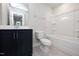 Clean bathroom with white walls, a dark vanity, and shower over tub at 928 Allen Park Dr, Knightdale, NC 27604