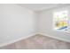 Neutral bedroom features a single window with a backyard view at 928 Allen Park Dr, Knightdale, NC 27604