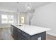 Kitchen island features a large sink and stainless steel dishwasher at 928 Allen Park Dr, Knightdale, NC 27604