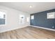 Bright, airy room with multiple windows and luxury vinyl flooring at 928 Allen Park Dr, Knightdale, NC 27604