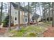 Expansive backyard with mature trees and a deck, perfect for outdoor entertaining at 100 Burlingame Way, Cary, NC 27513
