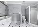 Bathroom featuring dual sinks, a toilet, and walk-in shower at 100 Burlingame Way, Cary, NC 27513