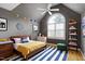 A bedroom featuring vaulted ceiling, a ceiling fan and large window at 100 Burlingame Way, Cary, NC 27513