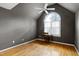 A bedroom featuring vaulted ceiling, a ceiling fan and a large window at 100 Burlingame Way, Cary, NC 27513