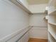 Walk-in closet with built-in shelving and plenty of storage space at 100 Burlingame Way, Cary, NC 27513