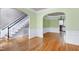 Spacious dining room features an arched doorway, staircase, and stylish light fixtures at 100 Burlingame Way, Cary, NC 27513