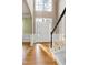 Inviting foyer with hardwood floors, staircase, and ample natural light at 100 Burlingame Way, Cary, NC 27513