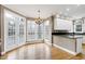 Bright eat-in kitchen area with hardwood floors, and large windows at 100 Burlingame Way, Cary, NC 27513