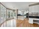 Open-concept kitchen and breakfast area features hardwood floors, stainless appliances, and breakfast area at 100 Burlingame Way, Cary, NC 27513