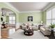 Cozy living room with plush seating, decorative accents, and ample natural light at 100 Burlingame Way, Cary, NC 27513