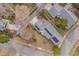 Stunning aerial view of home with solar panels, landscaped yard, and outdoor seating area at 101 Overlake Dr, Chapel Hill, NC 27516