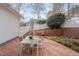 Backyard features a brick patio, outdoor seating, and a lush green yard at 101 Overlake Dr, Chapel Hill, NC 27516