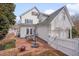 Backyard featuring a brick patio, outdoor seating, and a white house at 101 Overlake Dr, Chapel Hill, NC 27516