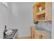 Charming bar area with wine storage, granite countertop, and elegant glass display at 101 Overlake Dr, Chapel Hill, NC 27516