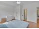 Bright bedroom features hardwood floors, ceiling fan and ensuite bathroom entrance at 101 Overlake Dr, Chapel Hill, NC 27516