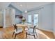 Cozy dining area with hardwood floors, a round table, and a backyard view at 101 Overlake Dr, Chapel Hill, NC 27516