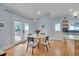 Bright dining area featuring a table and chairs, hardwood floors, and natural light at 101 Overlake Dr, Chapel Hill, NC 27516