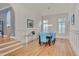 Inviting dining room with ample windows, stylish seating, and hardwood flooring at 101 Overlake Dr, Chapel Hill, NC 27516