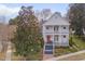 Charming two-story white home with a welcoming red door and double front porches at 101 Overlake Dr, Chapel Hill, NC 27516