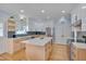 Modern kitchen featuring white cabinets, stainless steel appliances, and a large island at 101 Overlake Dr, Chapel Hill, NC 27516