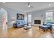 Cozy living room featuring a fireplace, hardwood floors, and neutral paint at 101 Overlake Dr, Chapel Hill, NC 27516