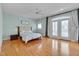 Spacious main bedroom with hardwood floors, and a balcony at 101 Overlake Dr, Chapel Hill, NC 27516