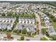 Aerial view of neighborhood with townhomes and tree lined streets at 1012 Palace Garden Way, Raleigh, NC 27603