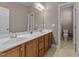 Bathroom with a double sink vanity, a tile floor, and a separate toilet area at 1012 Palace Garden Way, Raleigh, NC 27603