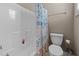 Bathroom featuring a shower/tub combo with a patterned curtain and a white toilet at 1012 Palace Garden Way, Raleigh, NC 27603