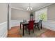 Elegant dining room with hardwood floors, wainscoting, and stylish chandelier at 1012 Palace Garden Way, Raleigh, NC 27603