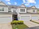 Townhome complex with attached garages and well maintained landscaping at 1012 Palace Garden Way, Raleigh, NC 27603