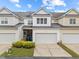 Well-maintained townhome with attached garage and manicured landscaping at 1012 Palace Garden Way, Raleigh, NC 27603