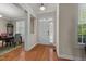 Bright foyer with hardwood floors and a view of the dining room at 1012 Palace Garden Way, Raleigh, NC 27603
