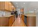 This kitchen offers wooden cabinetry, granite counters, stainless appliances, and hardwood floors at 1012 Palace Garden Way, Raleigh, NC 27603