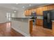 A kitchen with wood cabinets, stainless steel appliances, and granite countertops at 1012 Palace Garden Way, Raleigh, NC 27603