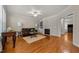 Spacious living room featuring hardwood floors, a fireplace, and ample seating at 1012 Palace Garden Way, Raleigh, NC 27603