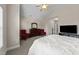 Spacious main bedroom with a ceiling fan, sitting area, and ample closet space at 1012 Palace Garden Way, Raleigh, NC 27603