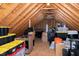 Attic storage space with exposed wood framework, filled with boxes and miscellaneous storage items at 104 Musgrove Cir, Cary, NC 27518