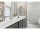 Bathroom with a double vanity, marble countertops, and plenty of storage space at 104 Musgrove Cir, Cary, NC 27518