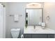 Well-lit bathroom featuring a toilet, vanity, mirror, towel rack and decorative house plant at 104 Musgrove Cir, Cary, NC 27518