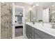 Bathroom with double sink vanity, marble countertops, and a glass shower door at 104 Musgrove Cir, Cary, NC 27518
