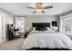 Comfortable bedroom with ceiling fan, plush carpet, and a built in vanity at 104 Musgrove Cir, Cary, NC 27518