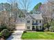 Well-manicured lawn leading to a two-story house at 104 Musgrove Cir, Cary, NC 27518