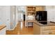 Kitchen with light wood floors and cabinets, island cooktop, and convenient kitchen workstation at 104 Musgrove Cir, Cary, NC 27518